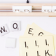 Illustration for article titled You Can Rearrange the Letters and Spell Out Any Message On This Scrabble Tile Rack Lamp